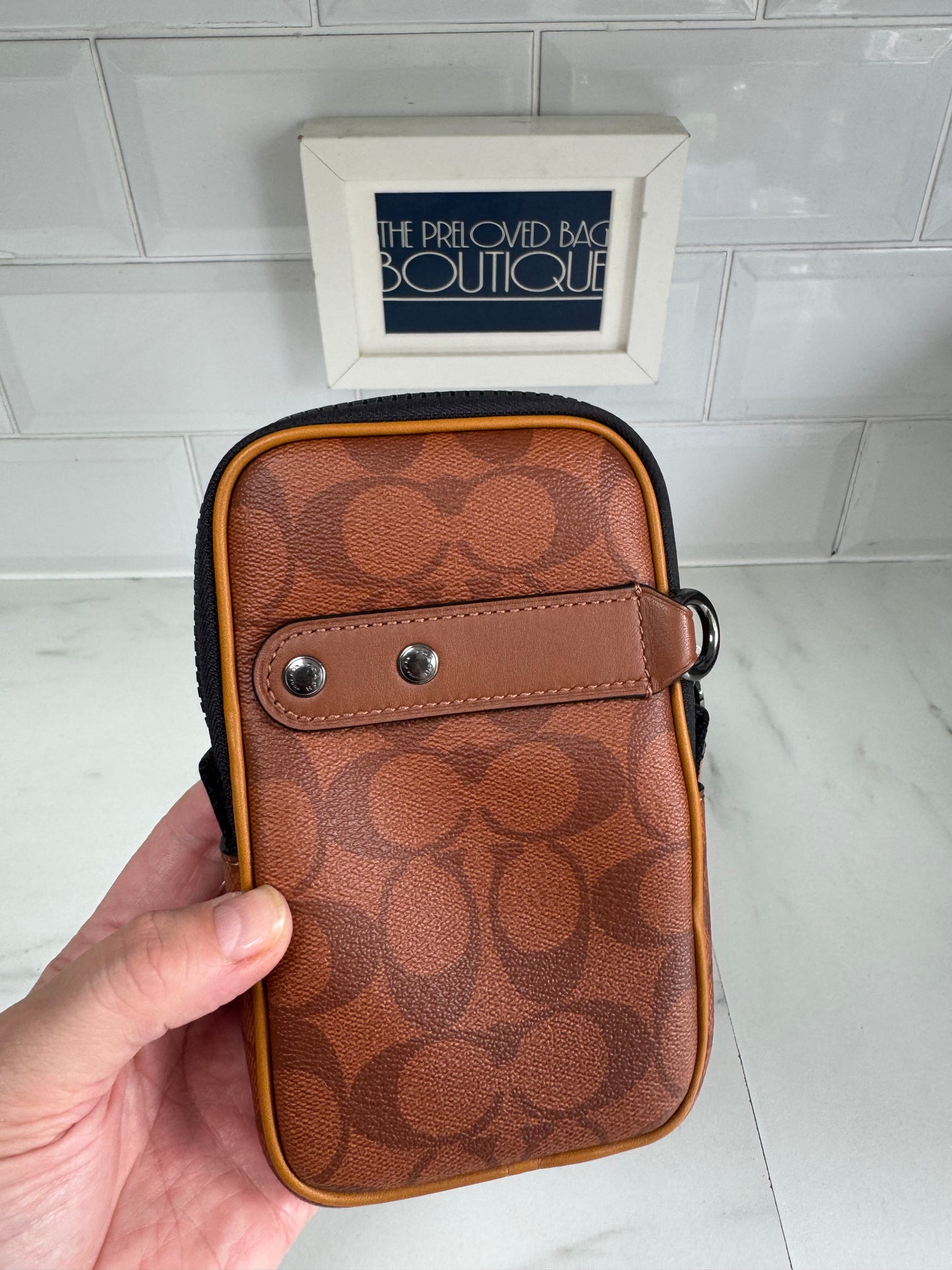 Coach North/South Hybrid Pouch in Signature Canvas - brown and red