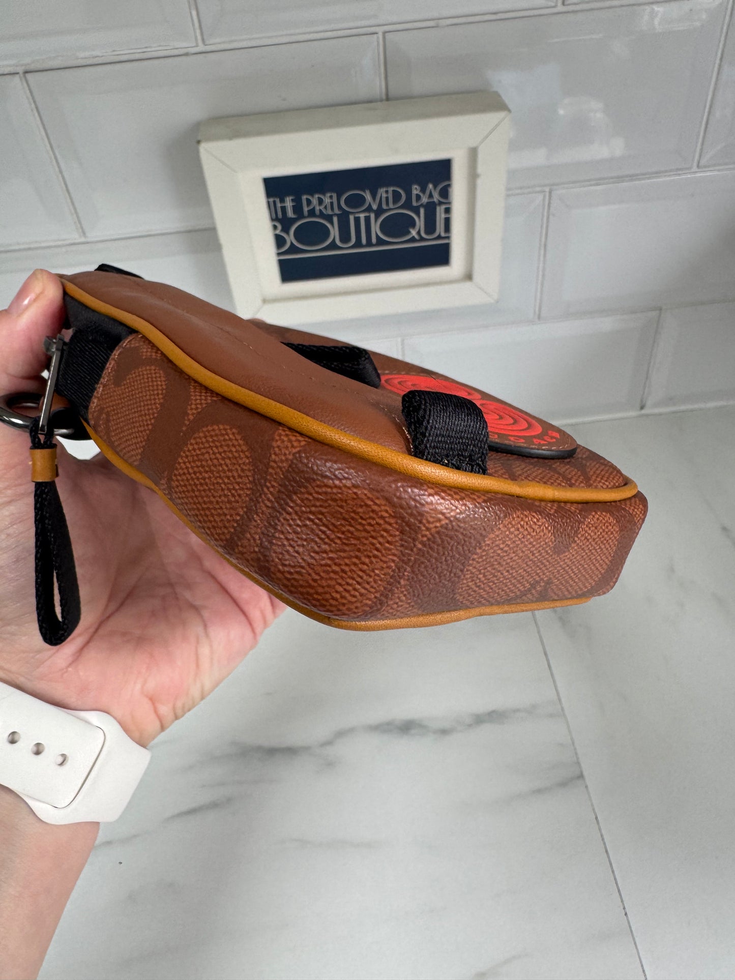 Coach North/South Hybrid Pouch in Signature Canvas - brown and red