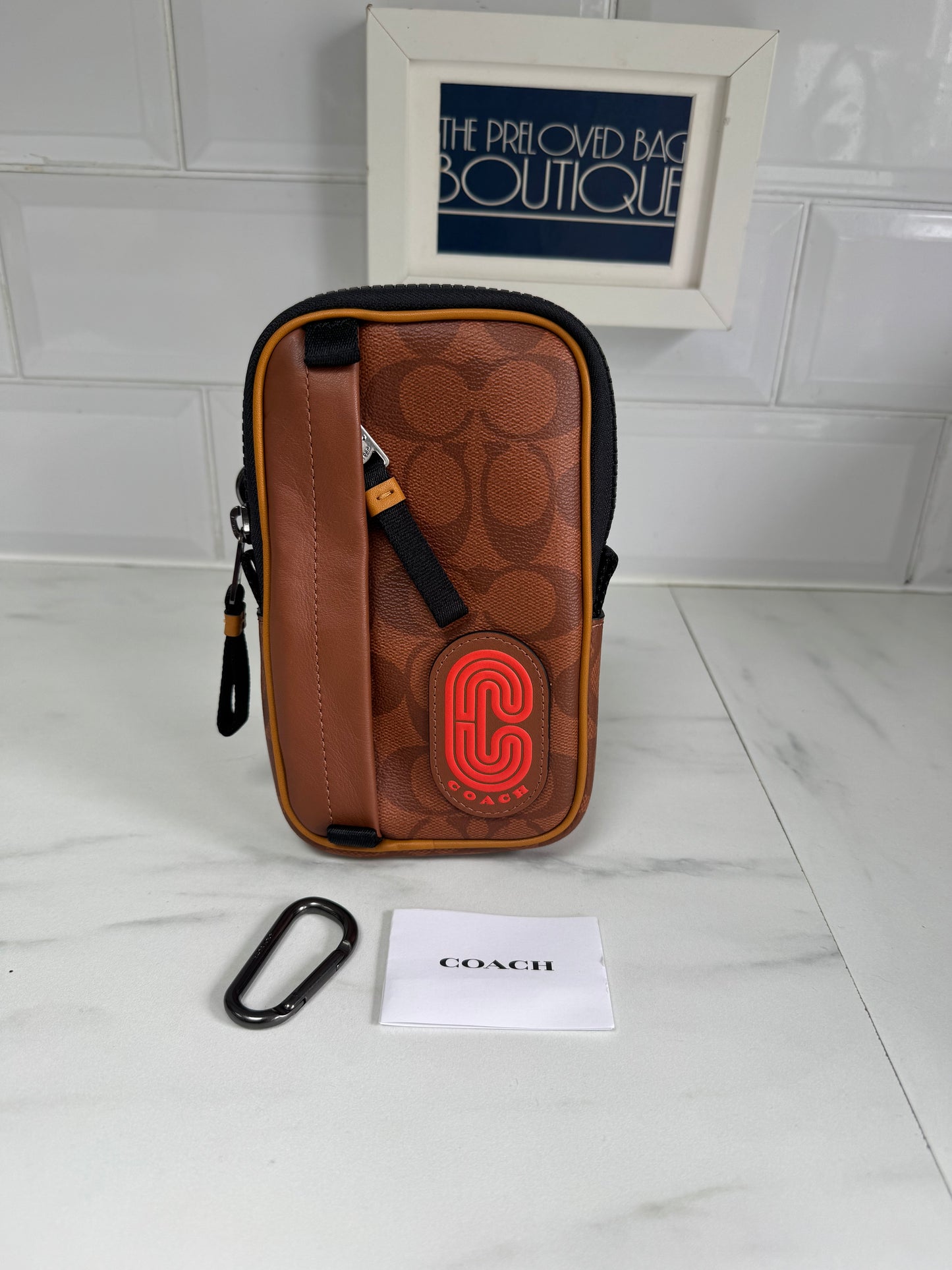 Coach North/South Hybrid Pouch in Signature Canvas - brown and red