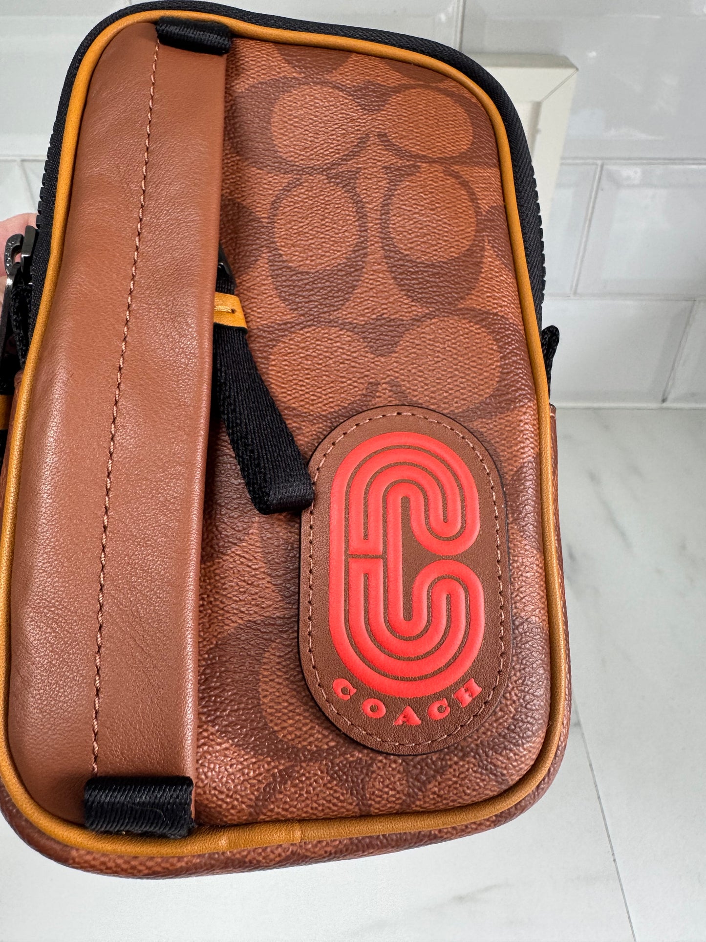 Coach North/South Hybrid Pouch in Signature Canvas - brown and red