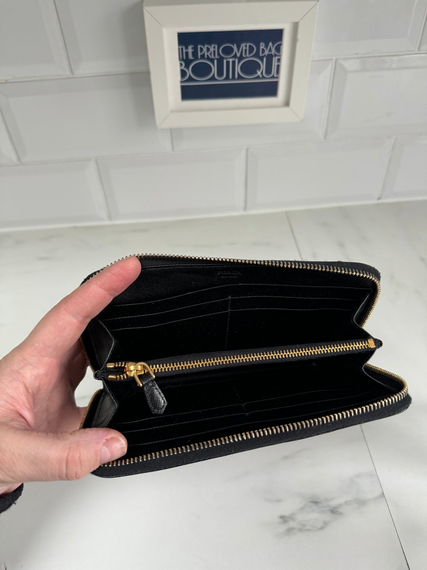 Prada small zip wallet best sale