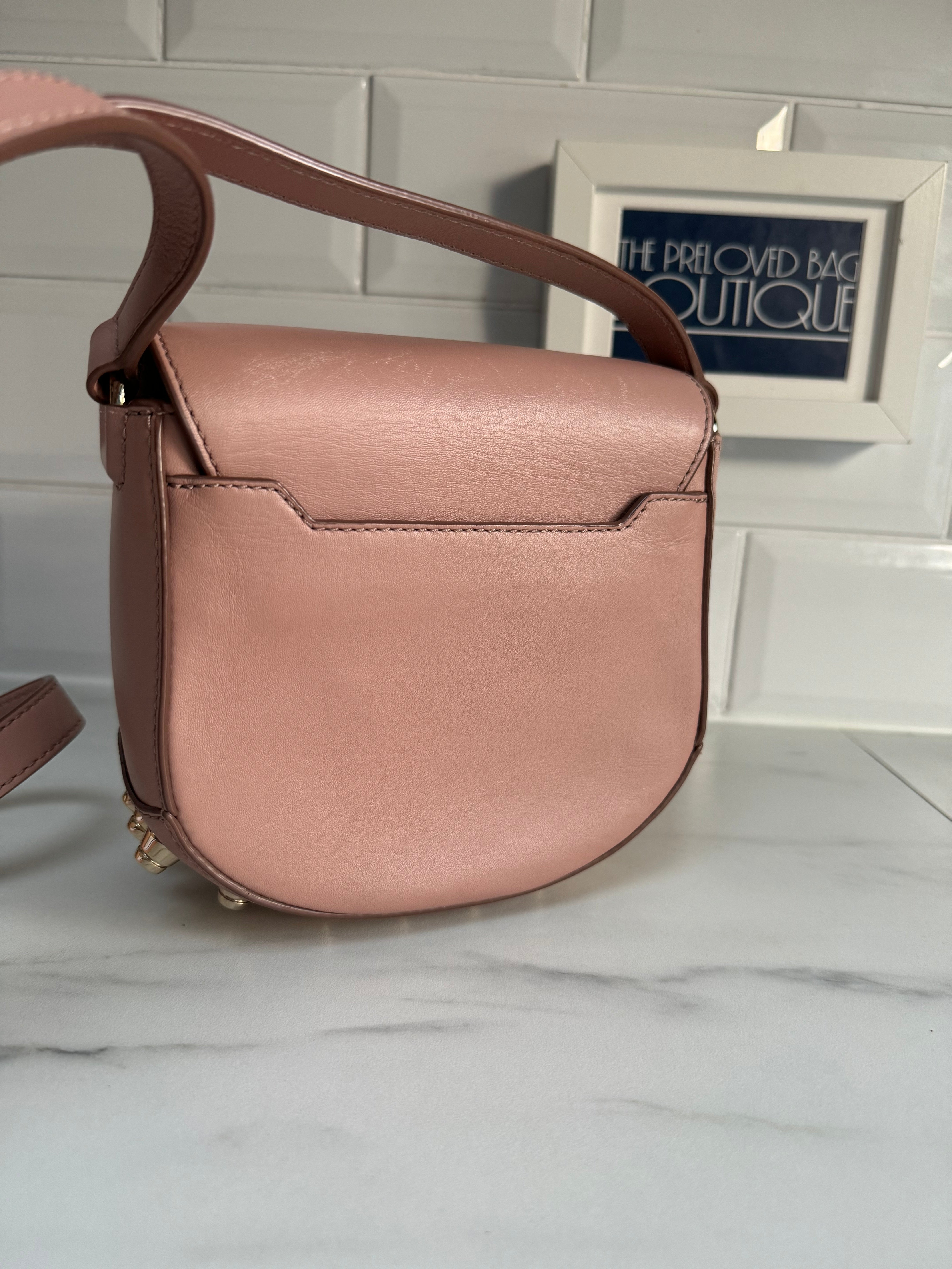 Pink saddle offers bag