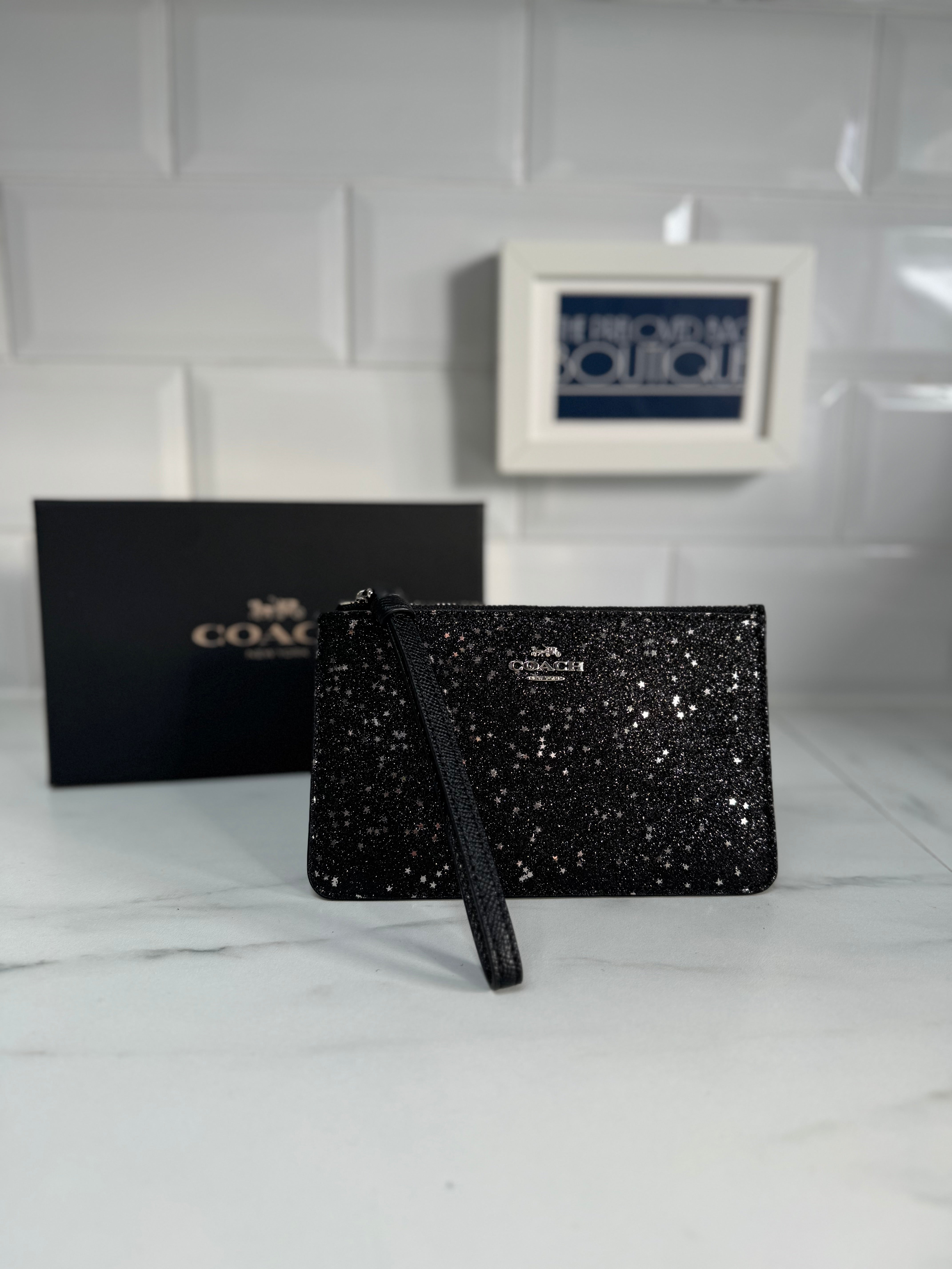 Coach brown sequin logo wristlet 2024