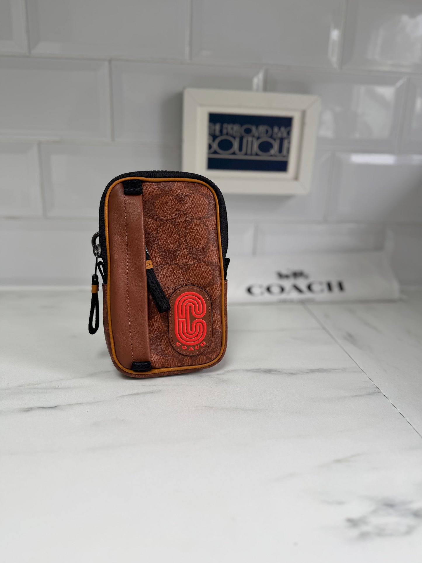 Coach North/South Hybrid Pouch in Signature Canvas - brown and red