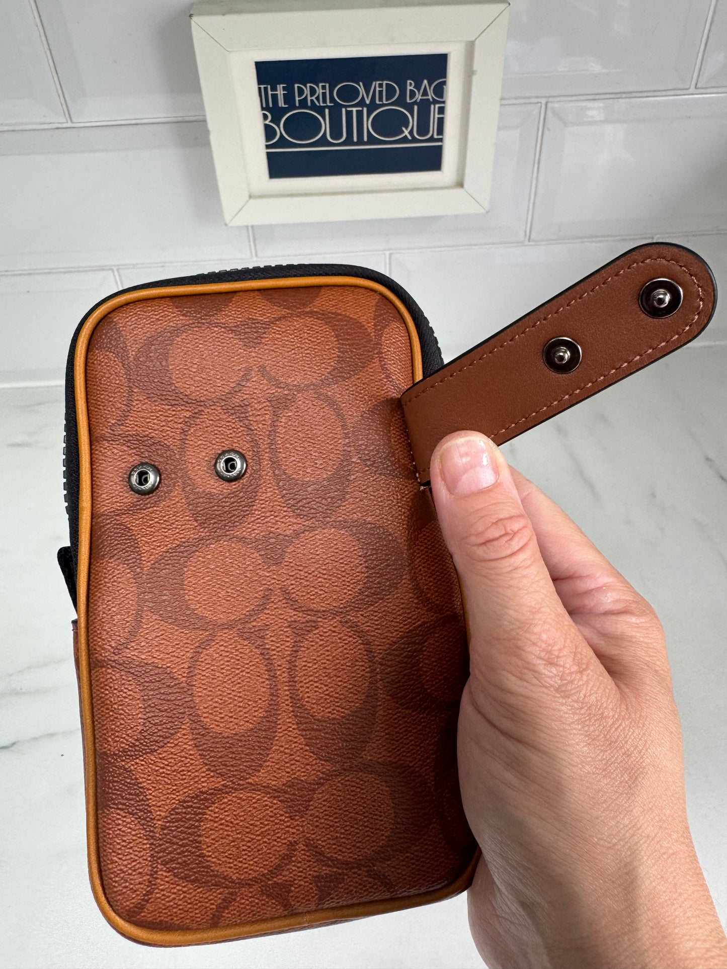 Coach North/South Hybrid Pouch in Signature Canvas - brown and red
