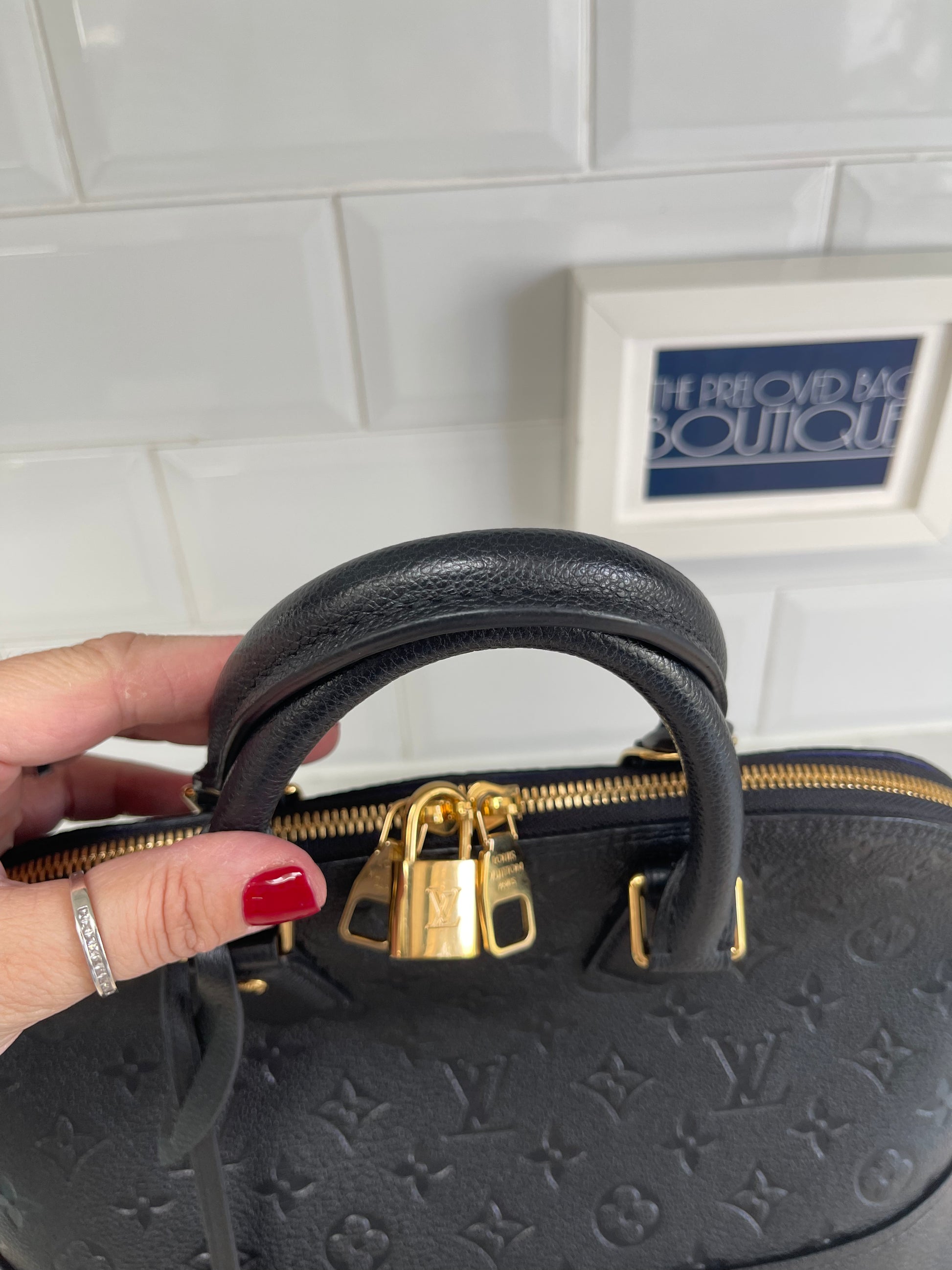 Louis Vuitton Alma Leather Handbag