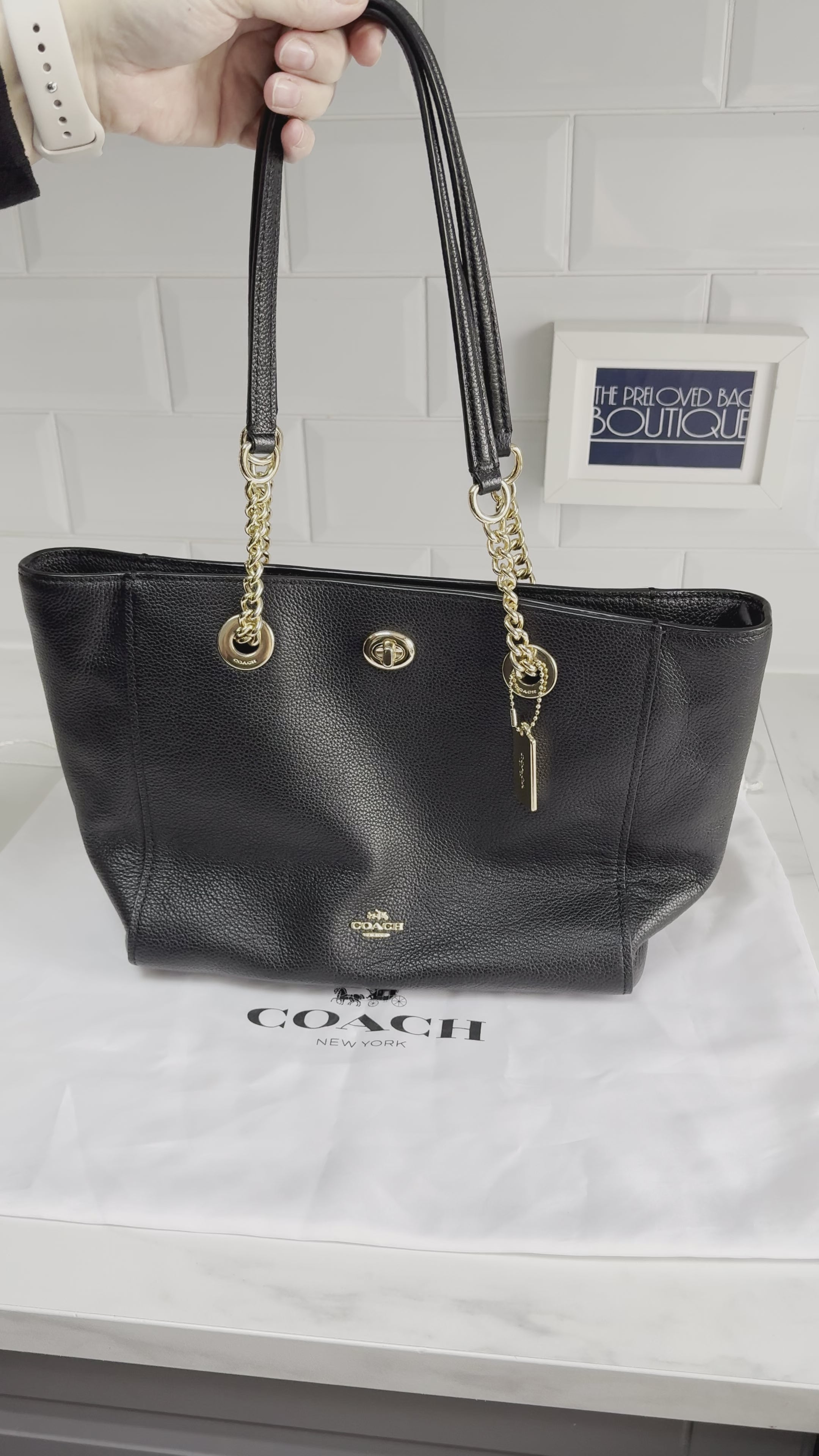 Black coach bag with gold online chain